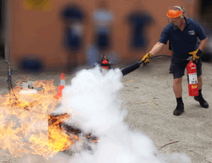 man putting out blaze